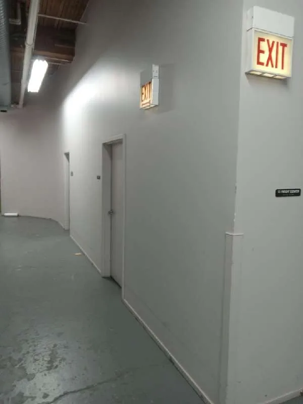 The same condo building hallway empty after the junk drive