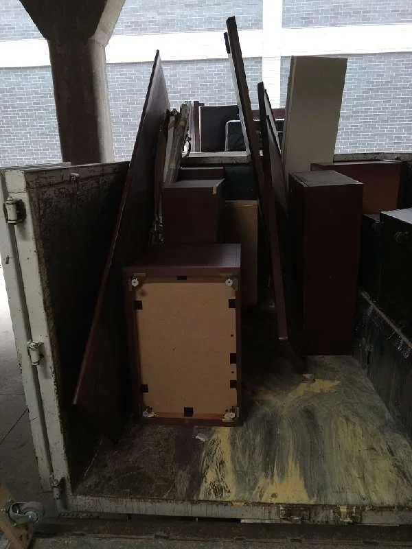 A JUNK Relief truck loaded with nightstands, cabinets and boards from the junk drive