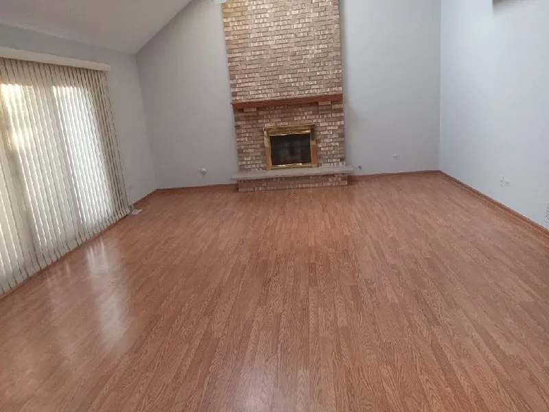 After: the same family room, empty (estate cleanouts, Lemont)