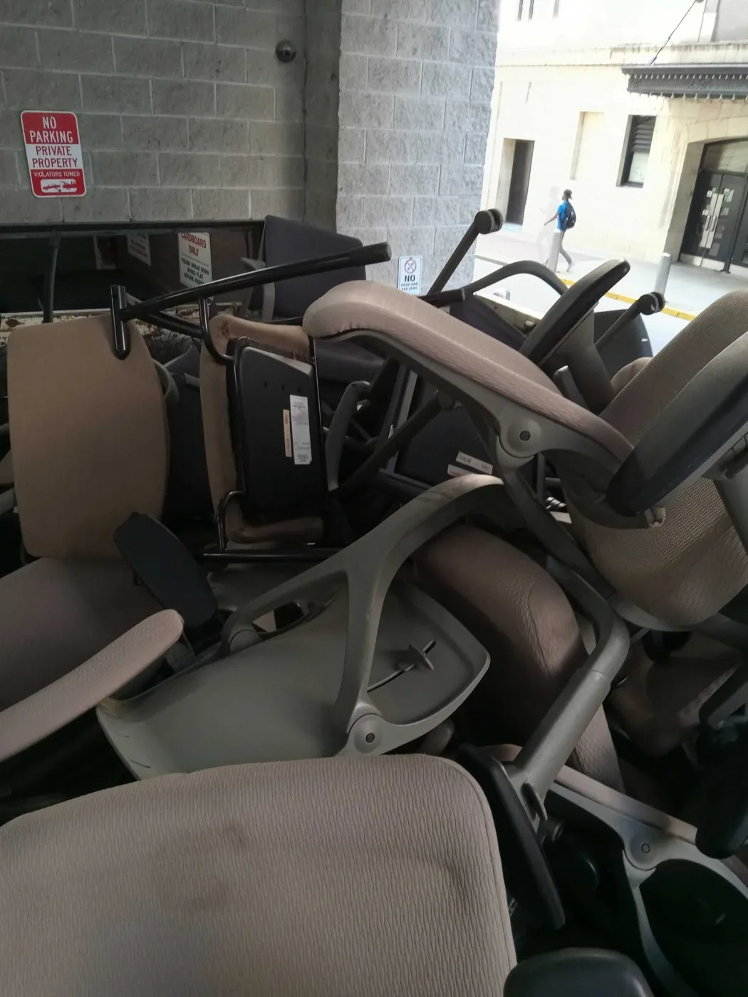 During: office chairs headed for the trucks at the loading dock (office cleanouts & office furniture removal, The Loop)