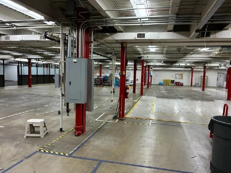 After: another stretch of the plant floor, cleared (commercial junk removal, Harwood Heights)