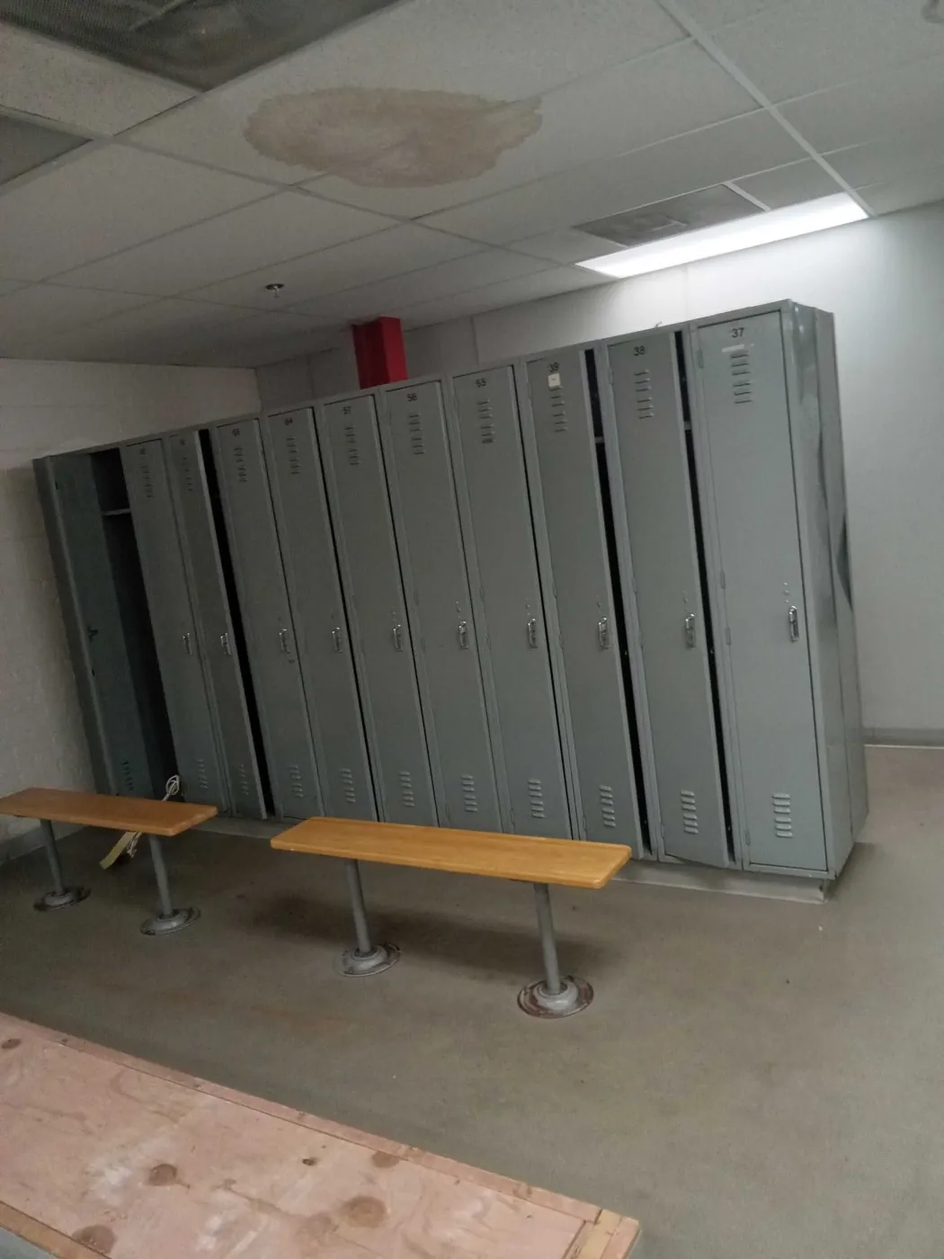 Before: locker banks and benches (commercial junk removal, Harwood Heights)