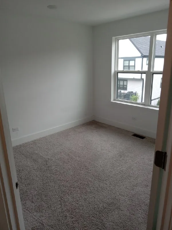 After: the bedroom, cleared (furniture removal, Morton Grove)