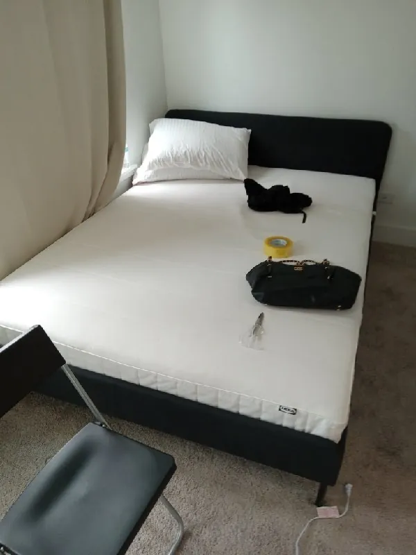 Before: bedroom with bed frame and mattress (furniture removal, Morton Grove)