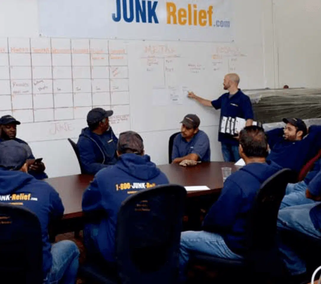 Junk Removal specialists attending the Daily Crew Meeting to prepare for projects on the schedule | JUNK Relief Chicago