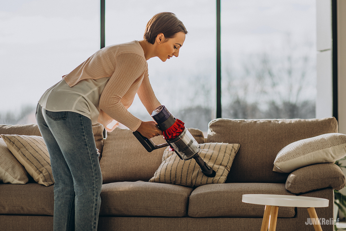 Woman Vacuuming Furniture