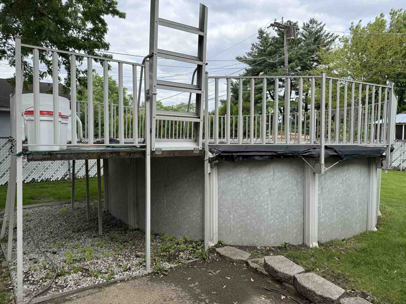 Before: the pool with attached raised deck and ladder