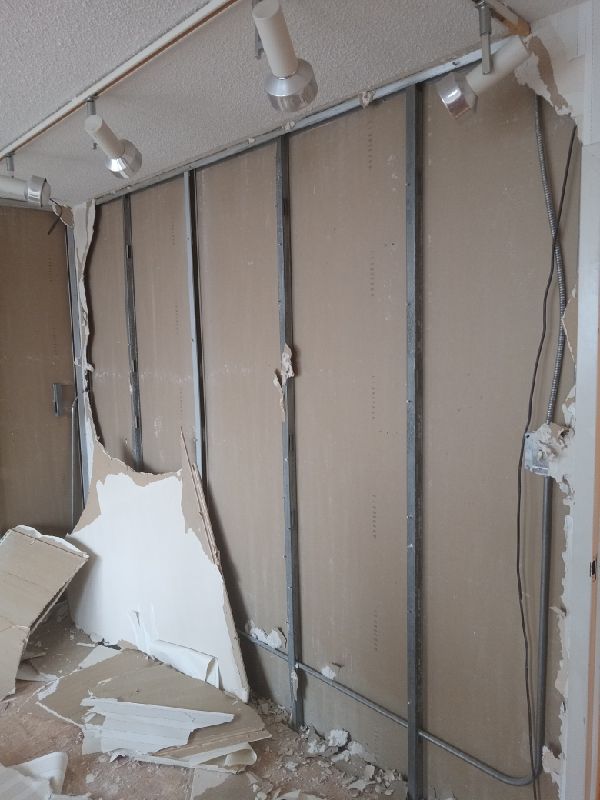 During: drywall stripped to the studs
