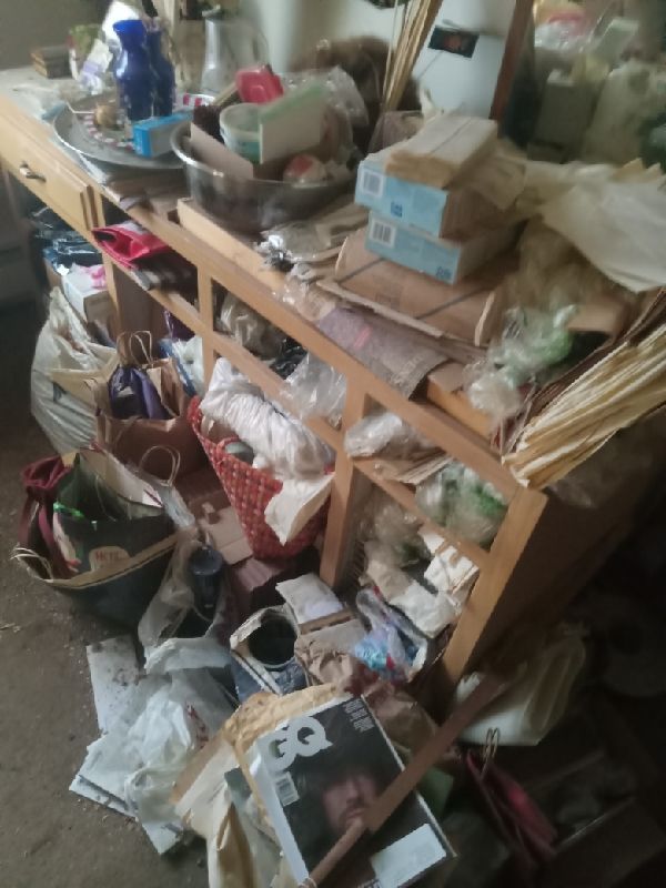 Before: years of paper, mail and packaging stacked on every surface