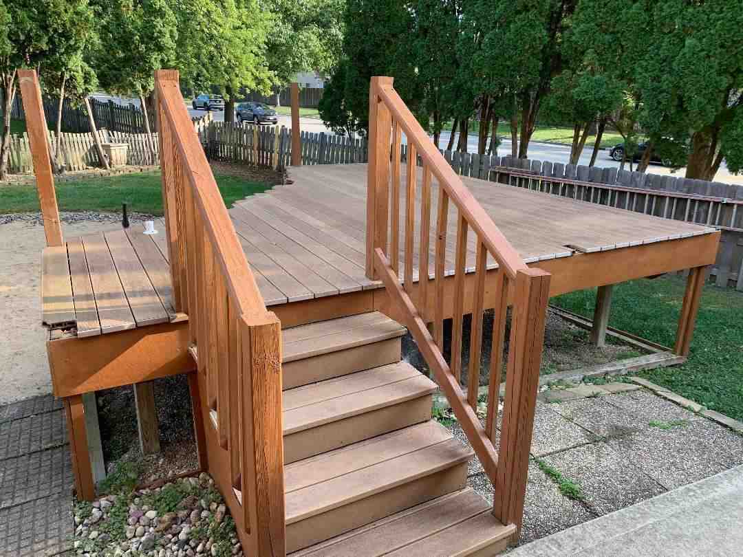 Before: the deck section slated for removal, with stairs and railing