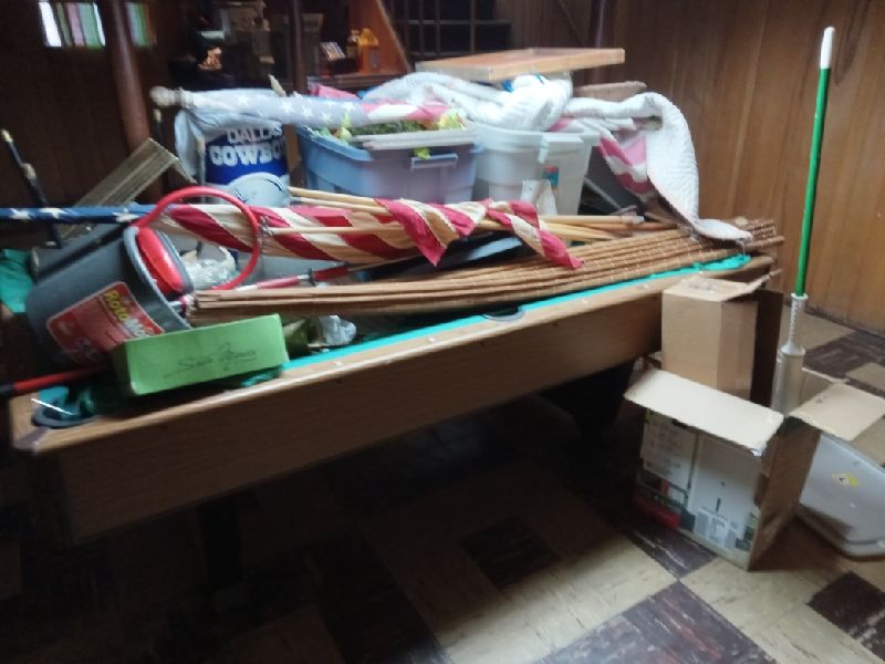 Before: the table covered in workshop odds and ends