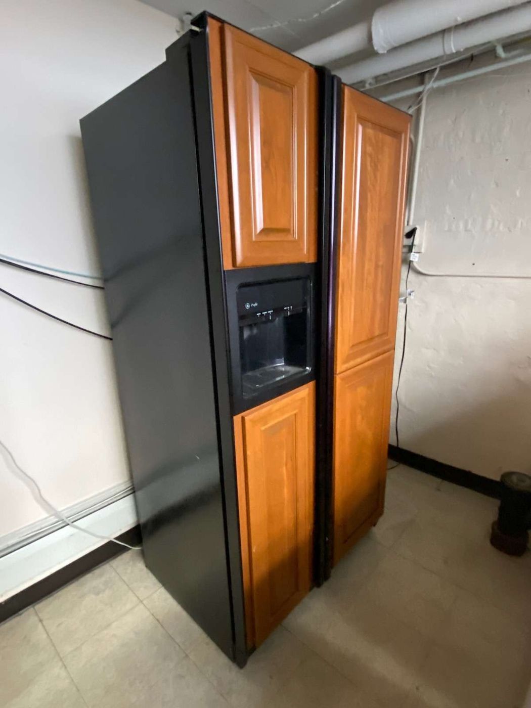 Before: the side-by-side refrigerator in the basement