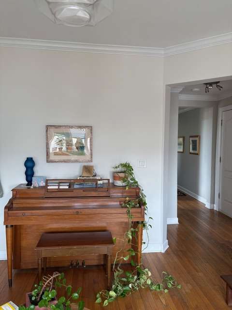 Before: the upright piano in the third-floor living room